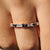 Baguette and round wedding band crafted with a sleek design.