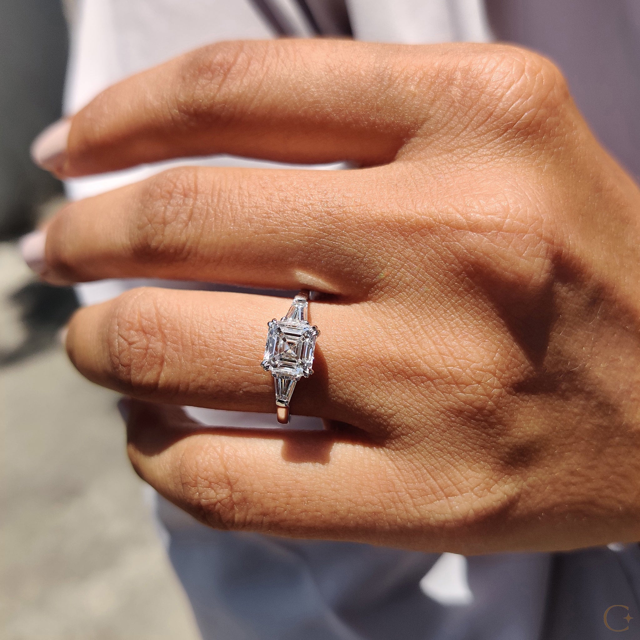 Baguette side stone ring with sleek, modern accents.
