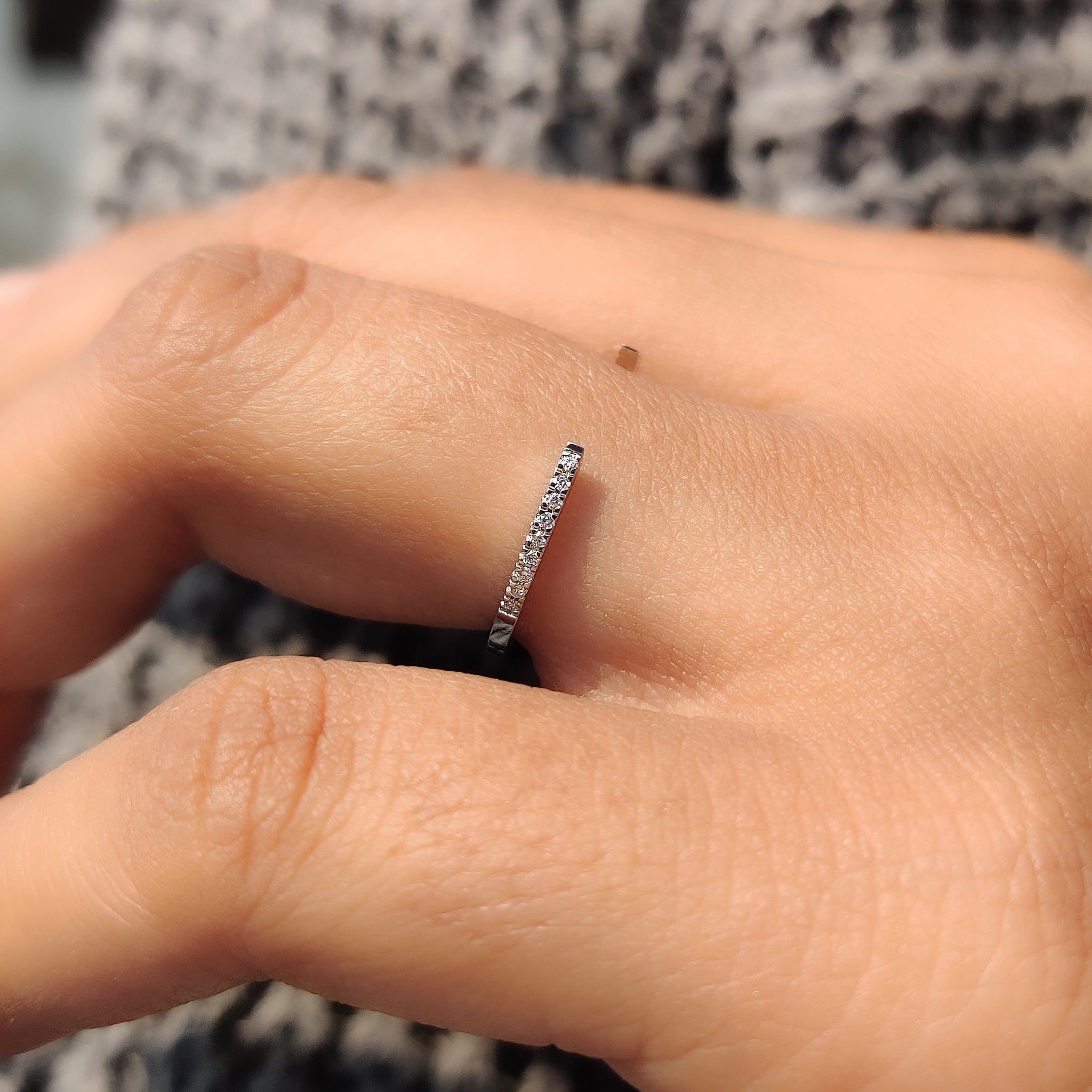 Carat Diamonds band featuring round diamonds.
