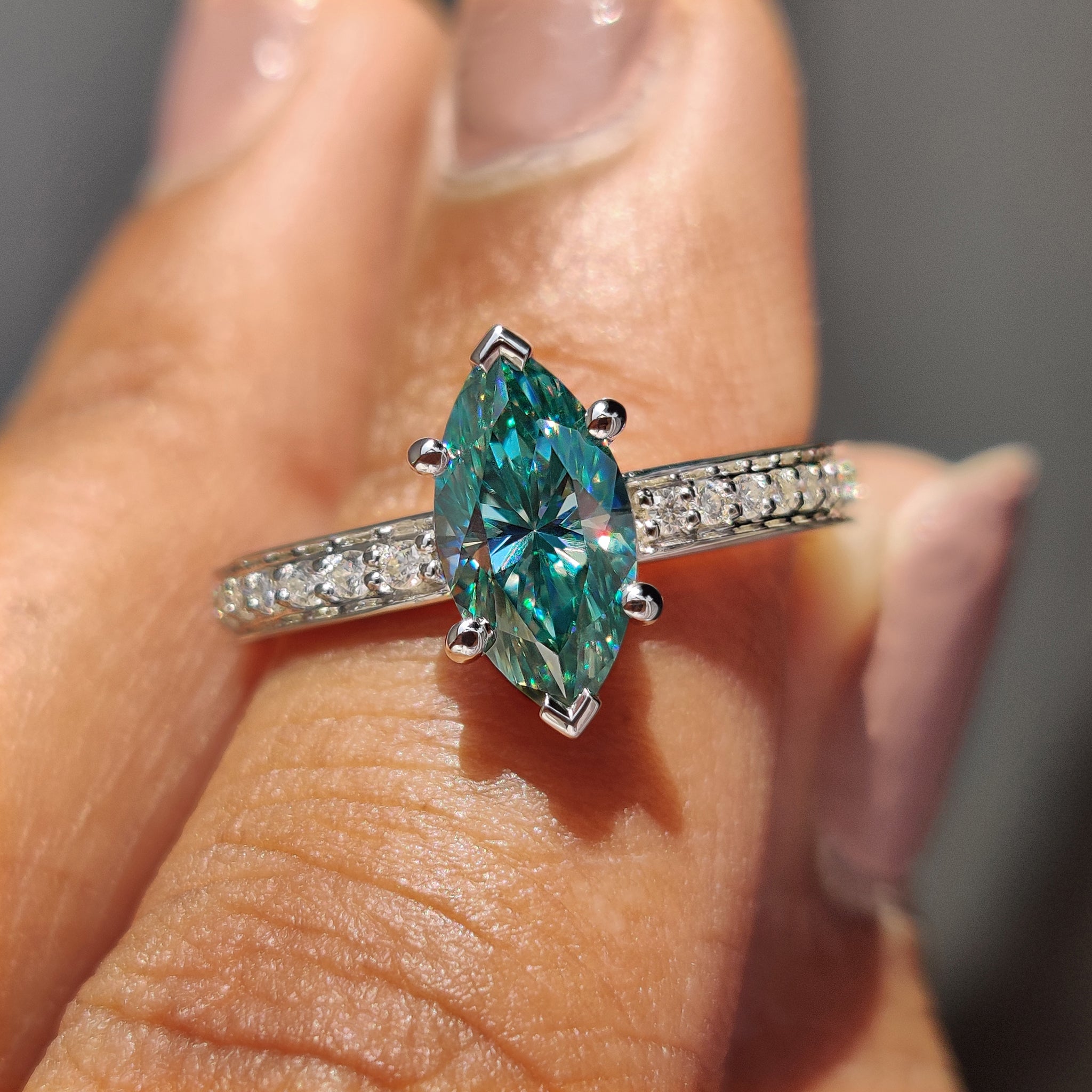 Handmade ring with marquise moissanite stone, perfect for a unique engagement.