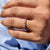 Full eternity moissanite wedding band featuring alternating marquise and round cut stones.