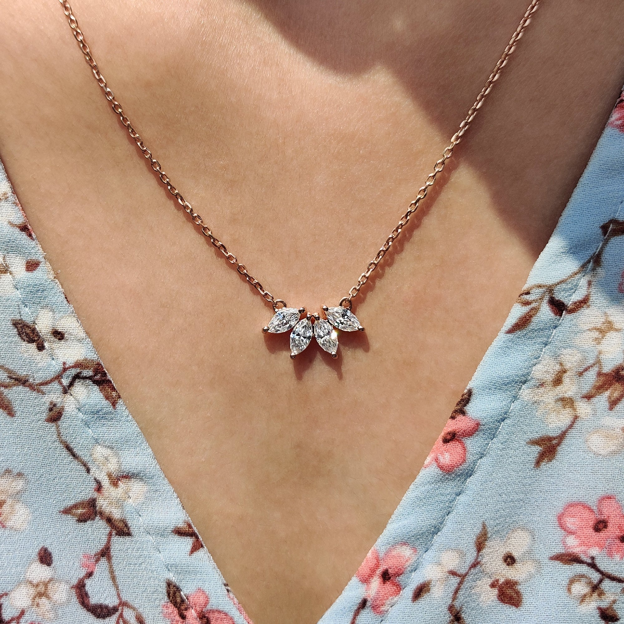 Arc Marquise Moissanite Pendant crafted as a Four Stone Wedding Pendant in rose gold pendant.
