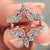 Ring enhancer wedding band designed to wrap around solitaires with round cut moissanite.