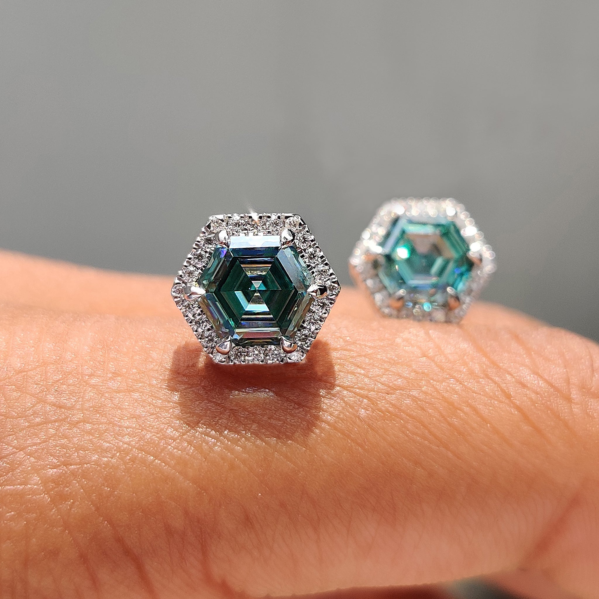 Hexagon Step cut Cyan Blue earrings designed with handmade jewelry and white gold earrings.
