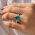 Proposal ring with pear shaped moissanite and elegant pave detailing
