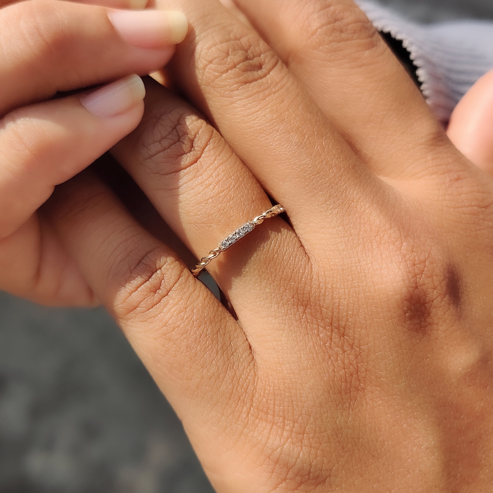 Twisted pave wedding band featuring sparkling diamonds.