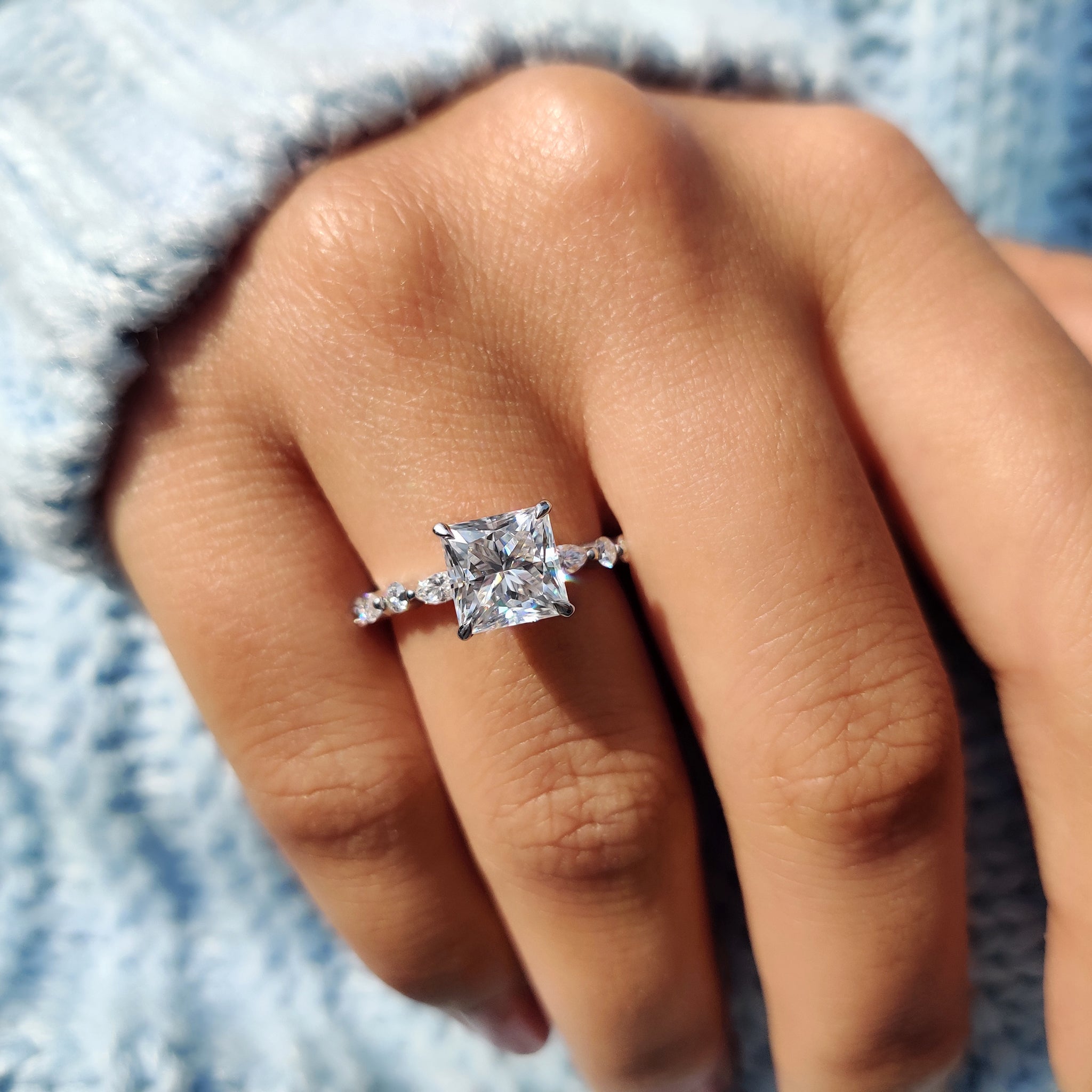 Pave setting band highlights small moissanite accents.
