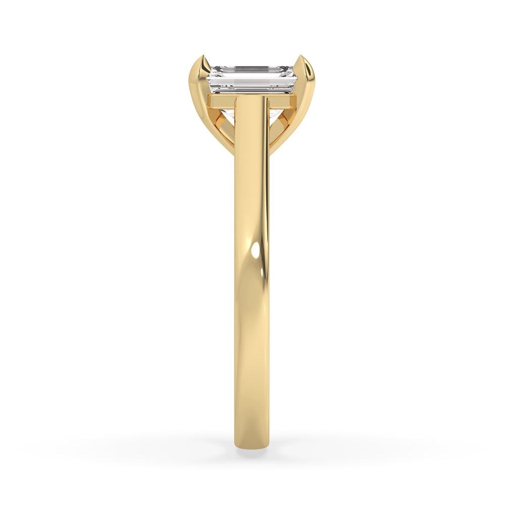 3 carat emerald cut diamond ring featuring petite claw prongs, offering a sleek and modern design.
