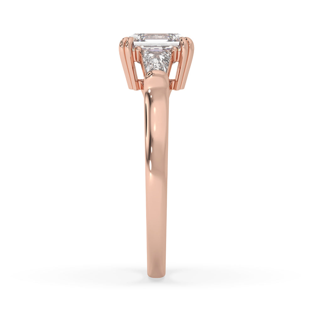 Asscher cut diamond ring on finger featuring double claw prong setting with baguette diamond accents for a vintage look.
