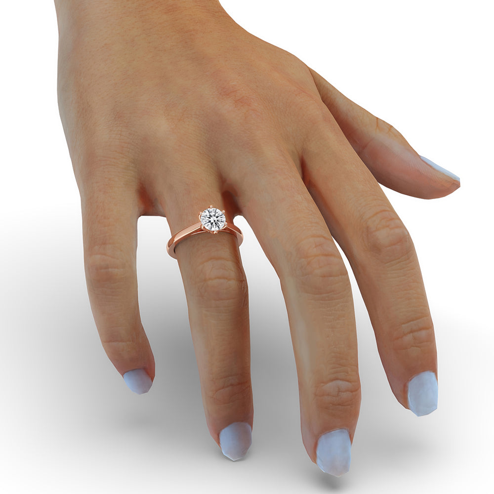 Handmade round solitaire diamond ring, set in simple gold, perfect as a solitaire round engagement ring for a special occasion
