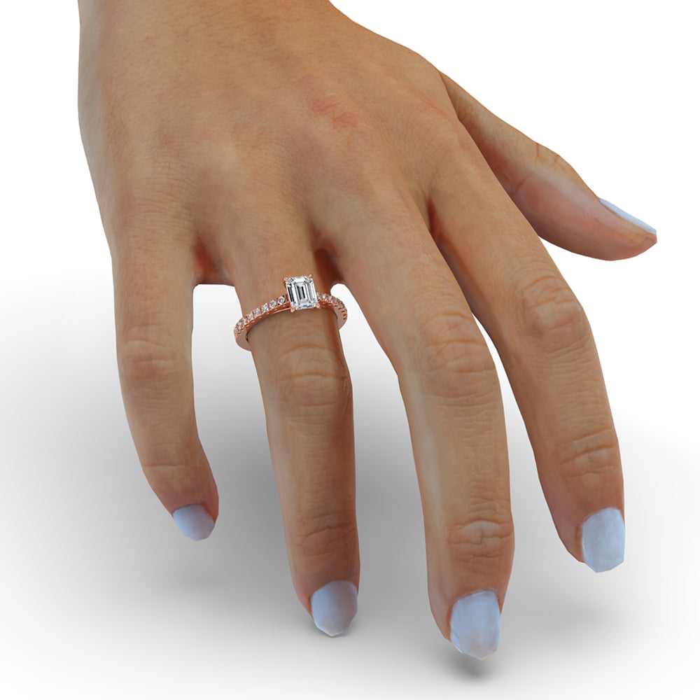 Timeless emerald cut emerald ring set in a pave engagement ring design, featuring an igi certified stone.
