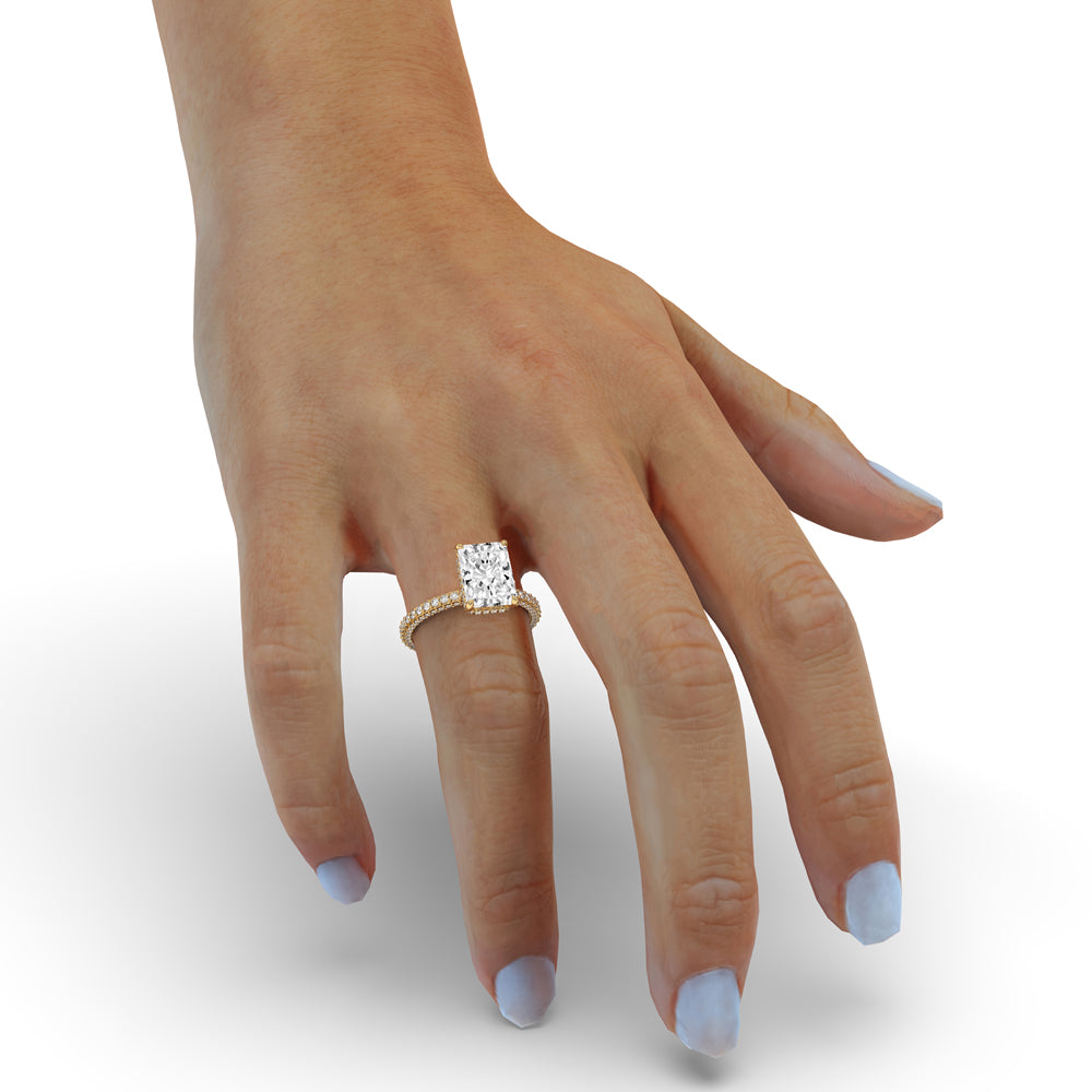 Engagement ring with hidden halo and 2 carat radiant cut diamond. Petite claw prongs.