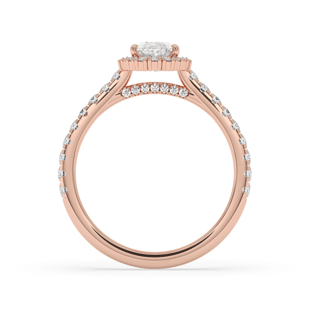 An exquisite oval with halo engagement ring, designed with a secure claw setting and a stunning Lab Grown Diamond centerpiece.
