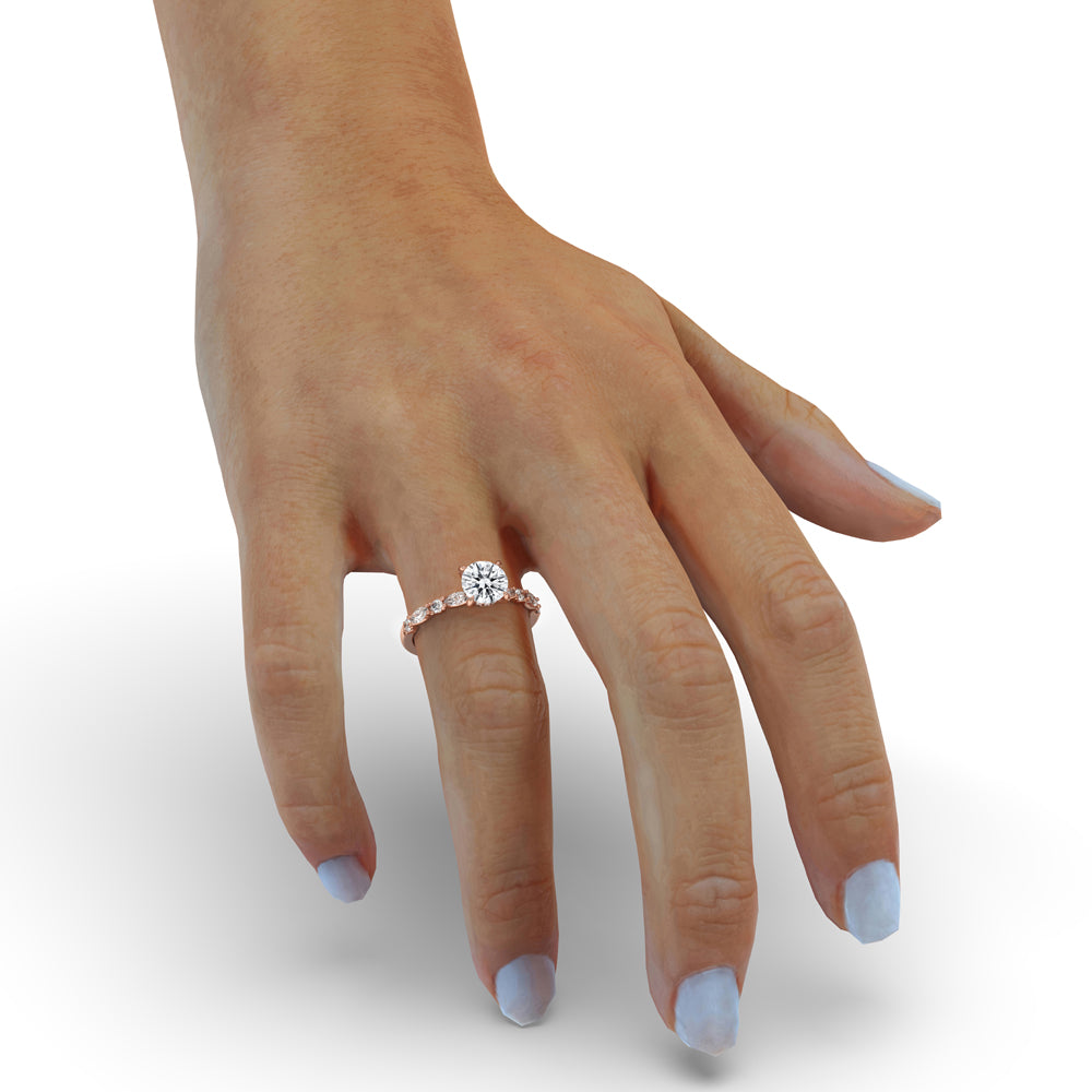 Micro pave engagement ring with a round cut diamond, perfect for a timeless, elegant look.
