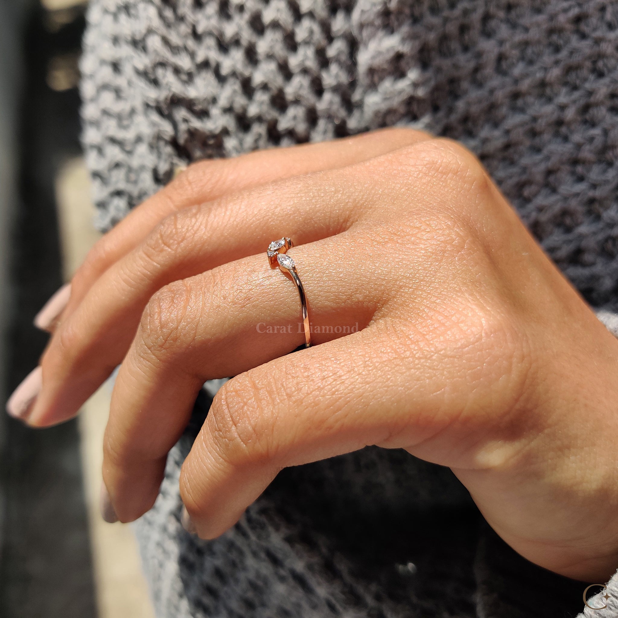 Rose gold wedding band displayed on a neutral background.
