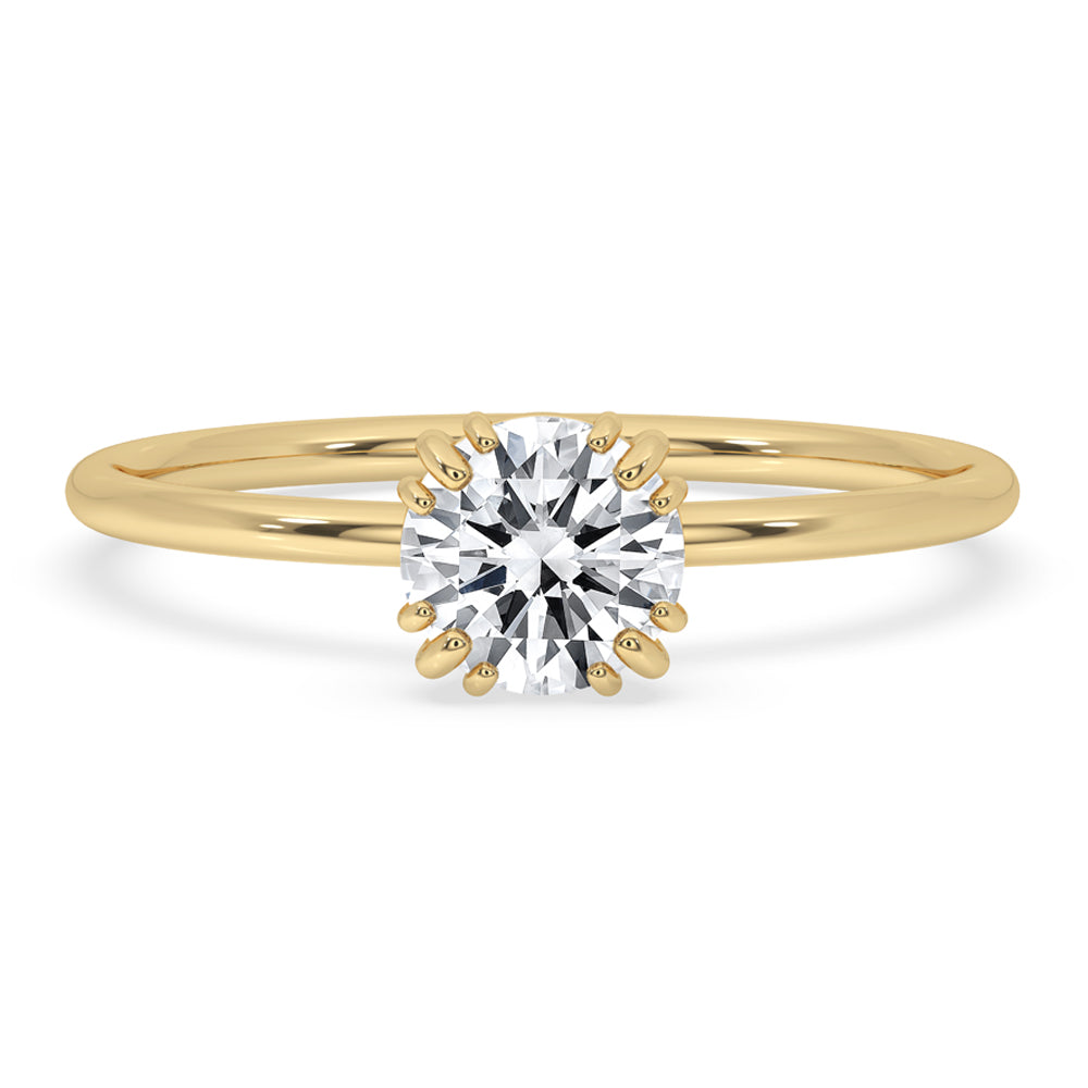 Round solitaire engagement ring with a classic triple prong ring setting and Lab Grown Diamond.