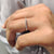 Floating bubble prong setting on a stunning moissanite ring.