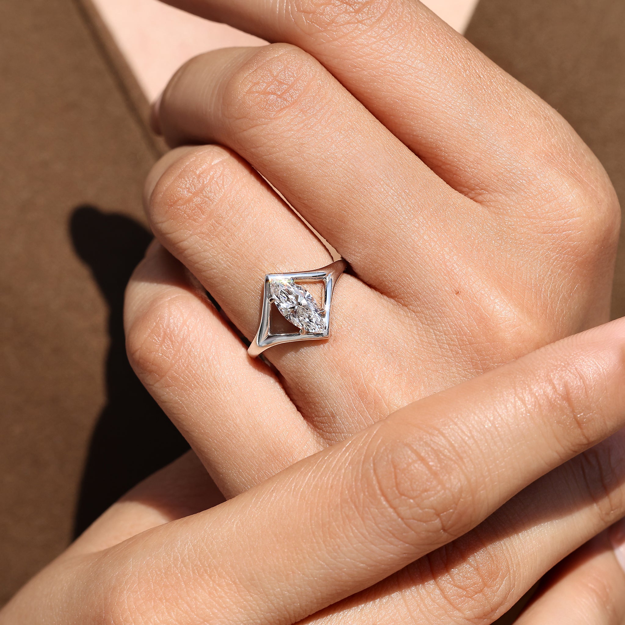 Handmade marquise solitaire ring with split shank.
