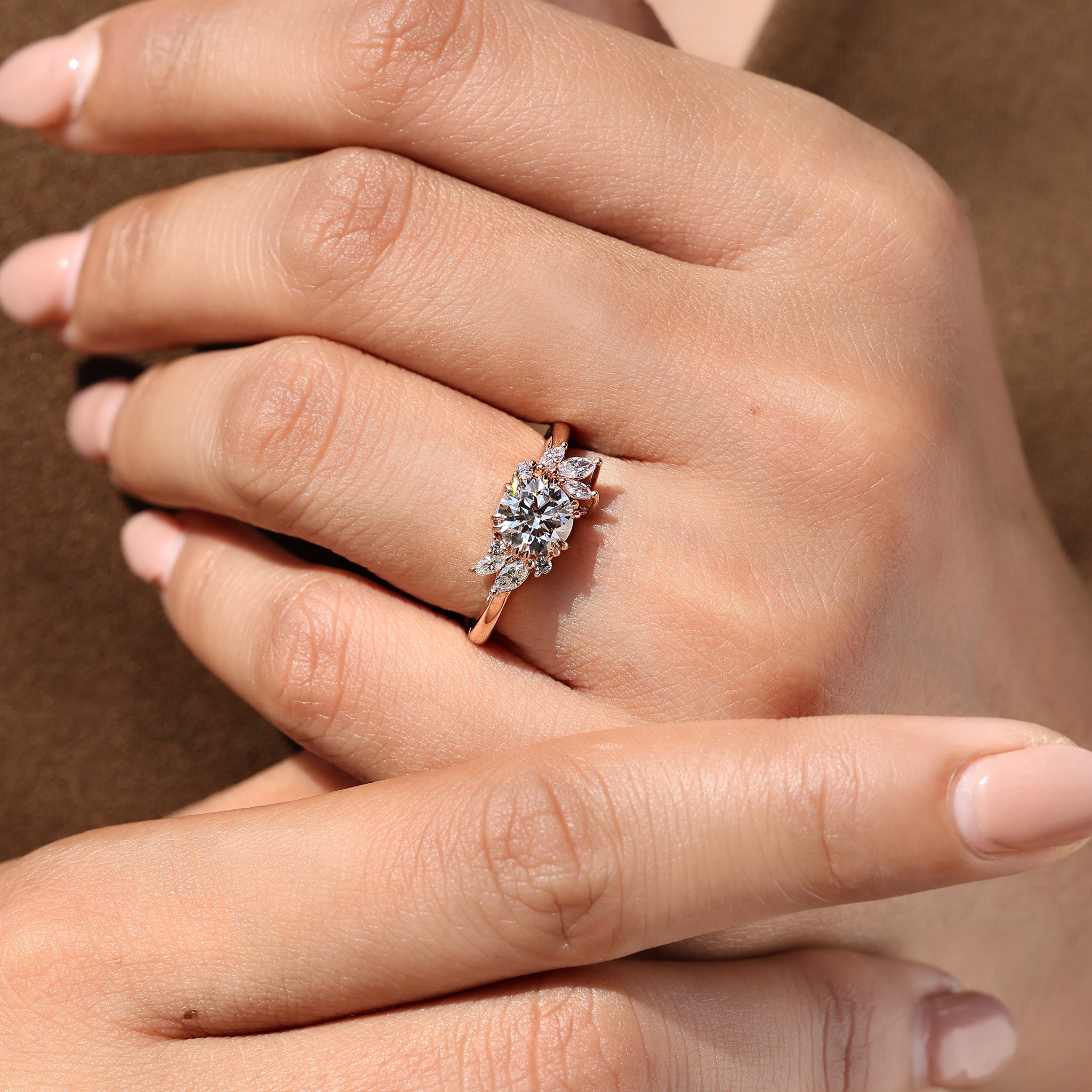 Round diamond ring with double claw prong design.
