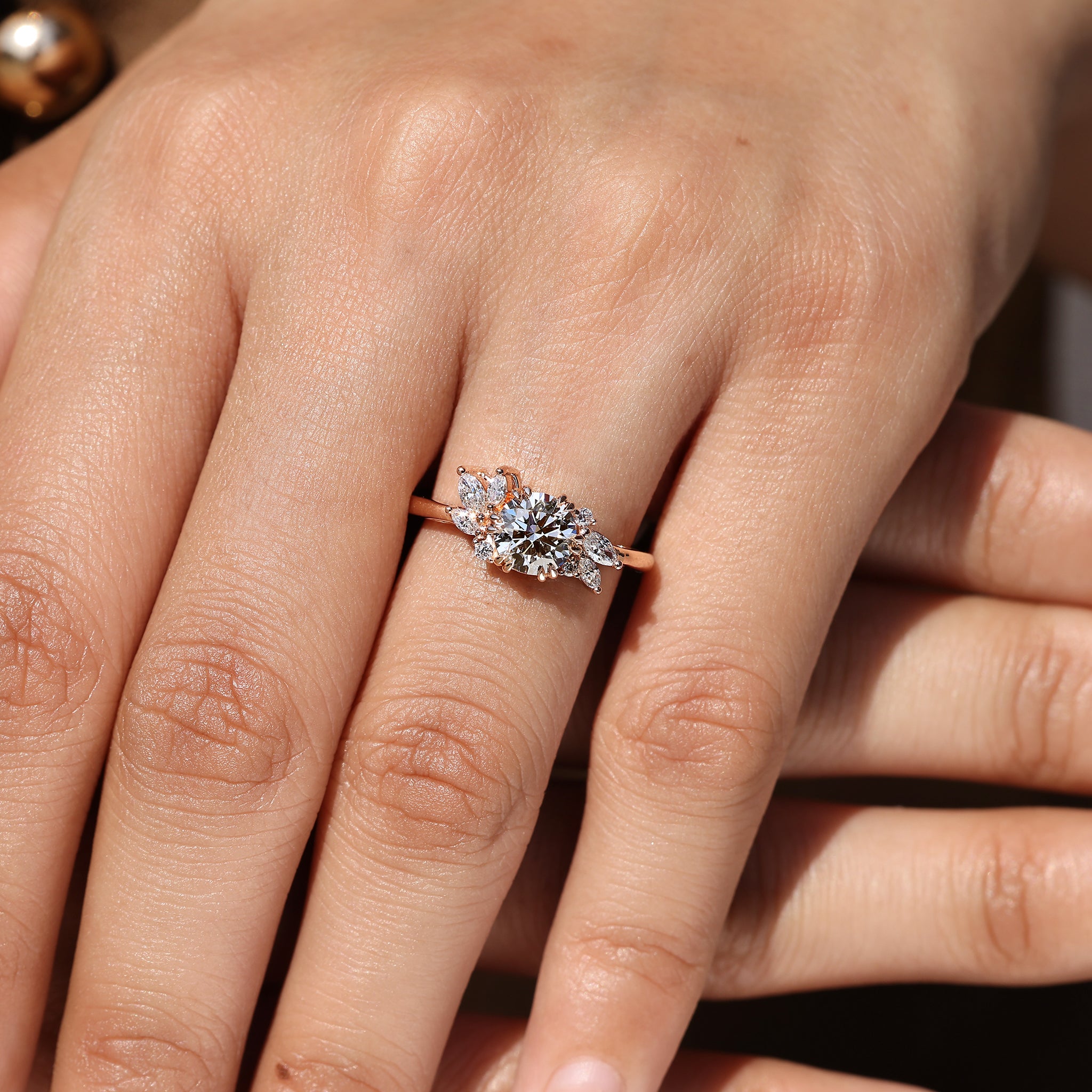 Handmade round diamond engagement ring with cluster style.
