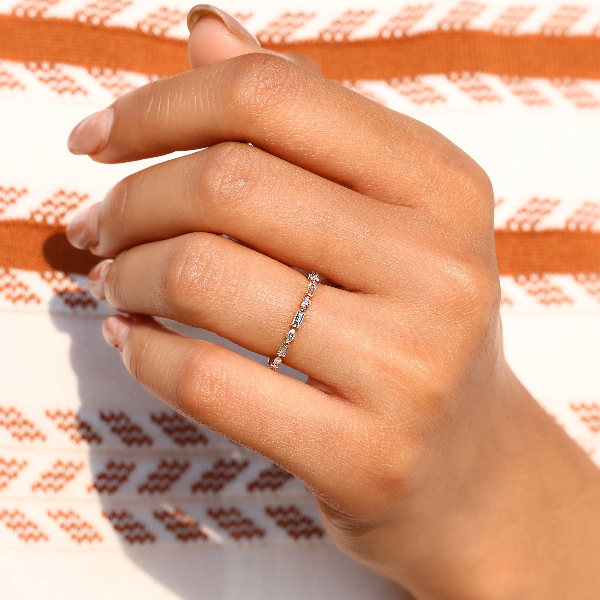 Full eternity band with baguette and marquise diamonds.
