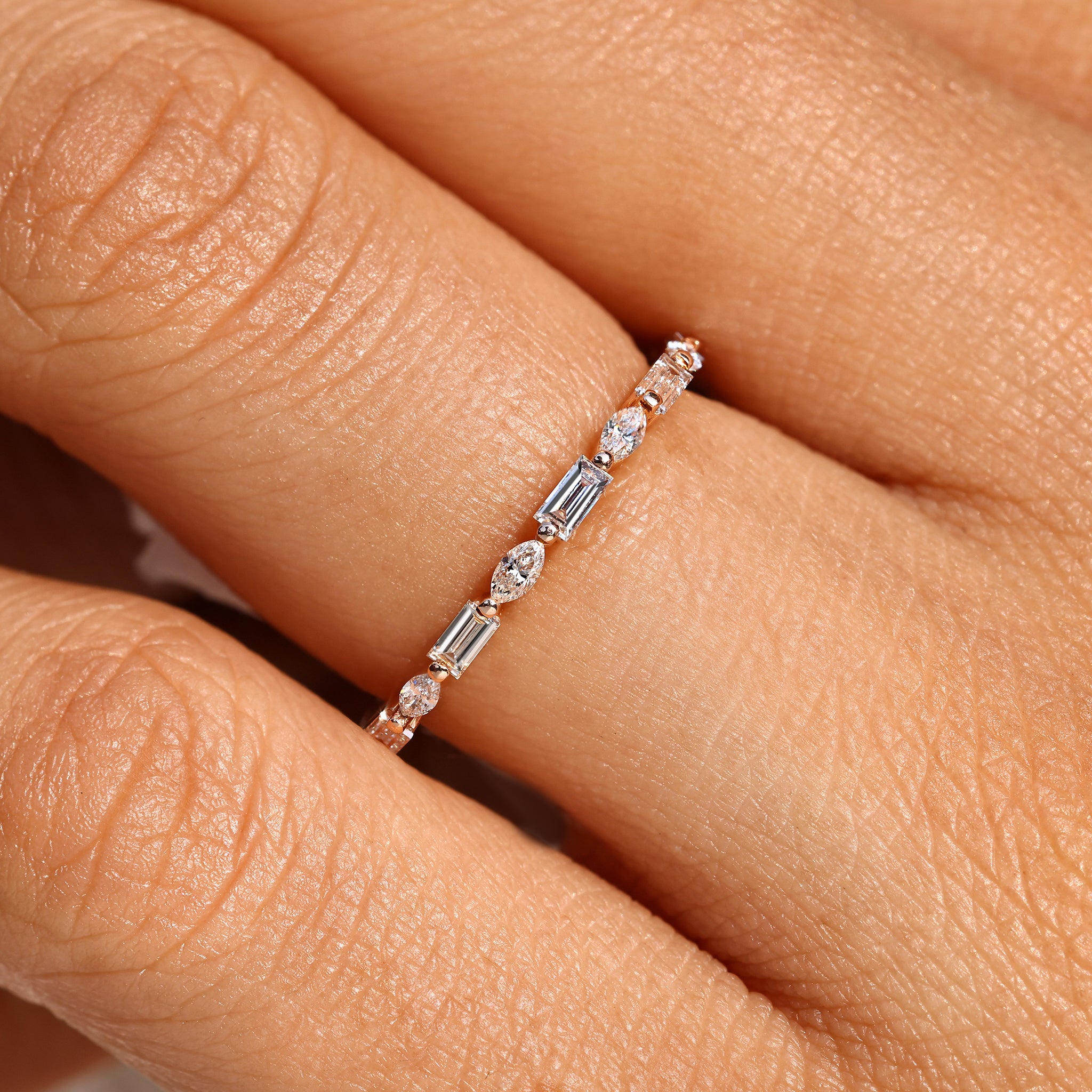 Handmade diamond eternity band with marquise stones.
