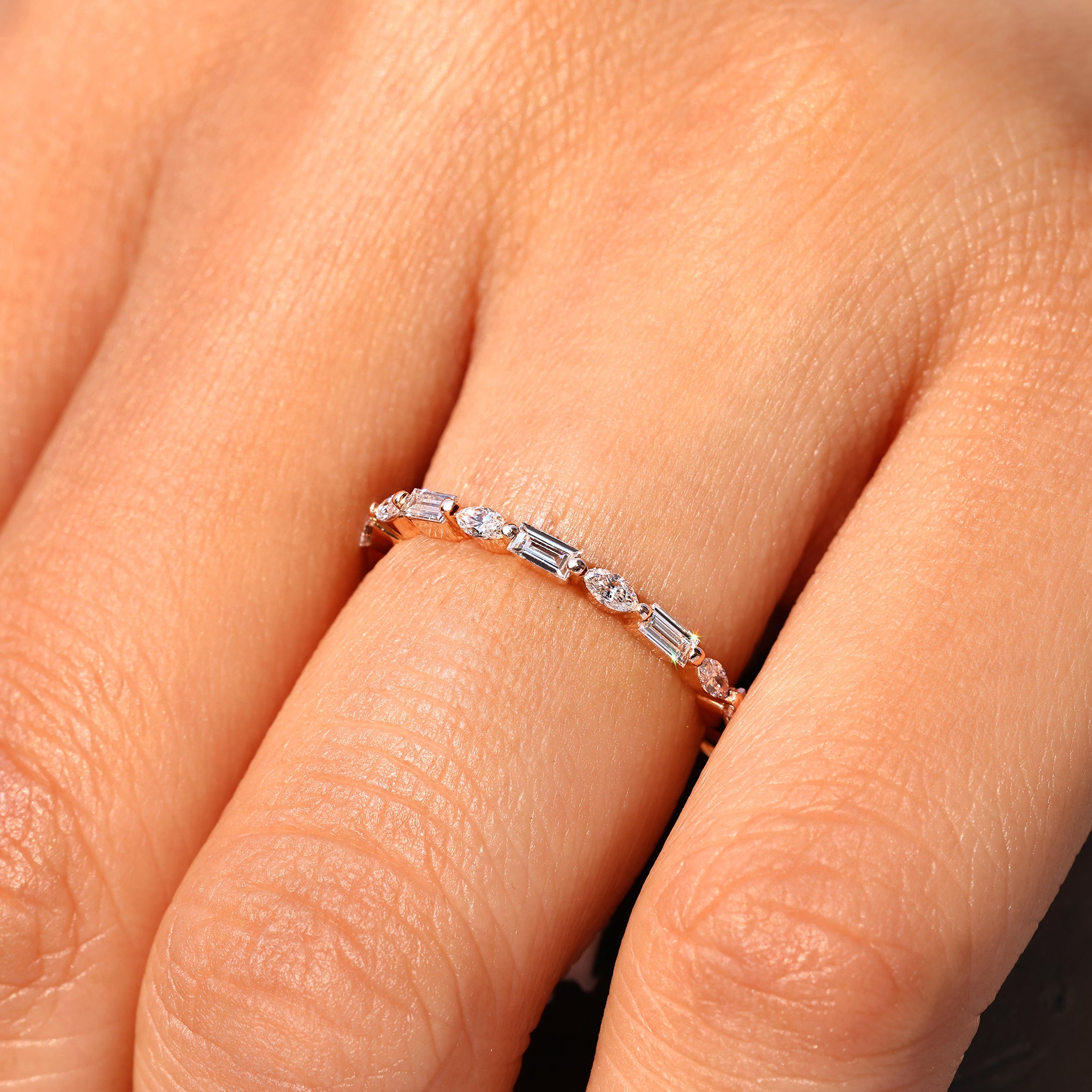 Shared prong marquise baguette diamond eternity band.
