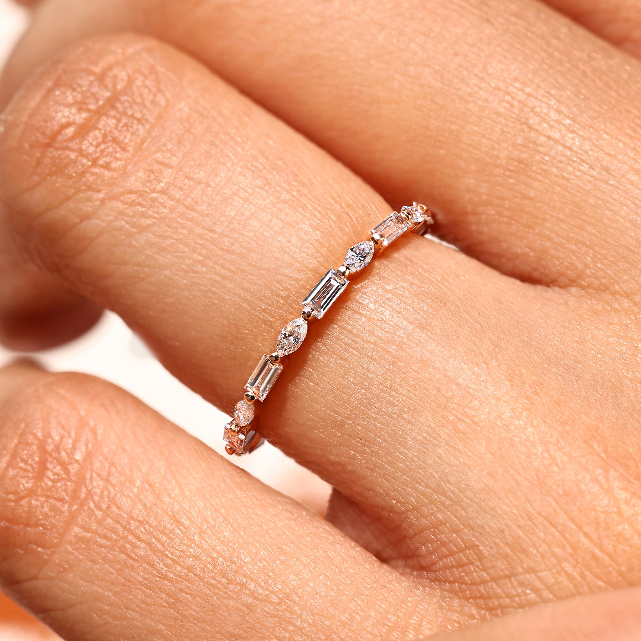 Diamond eternity band with elegant shared prong style.
