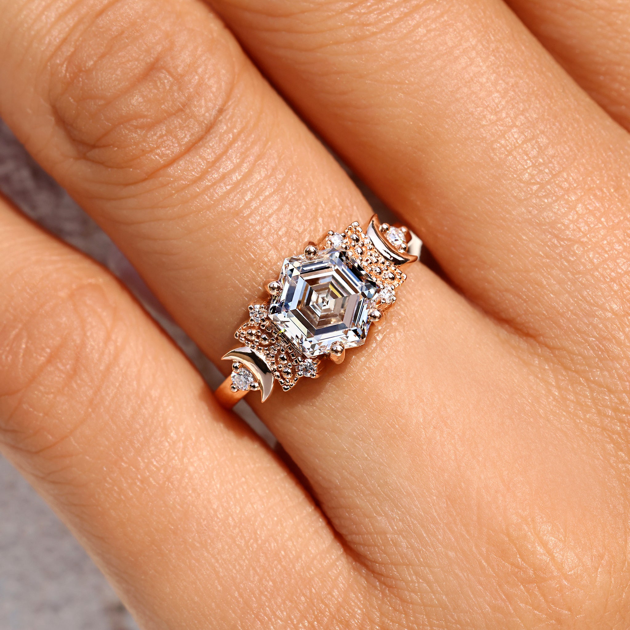 Four prong setting hexagon diamond engagement ring.
