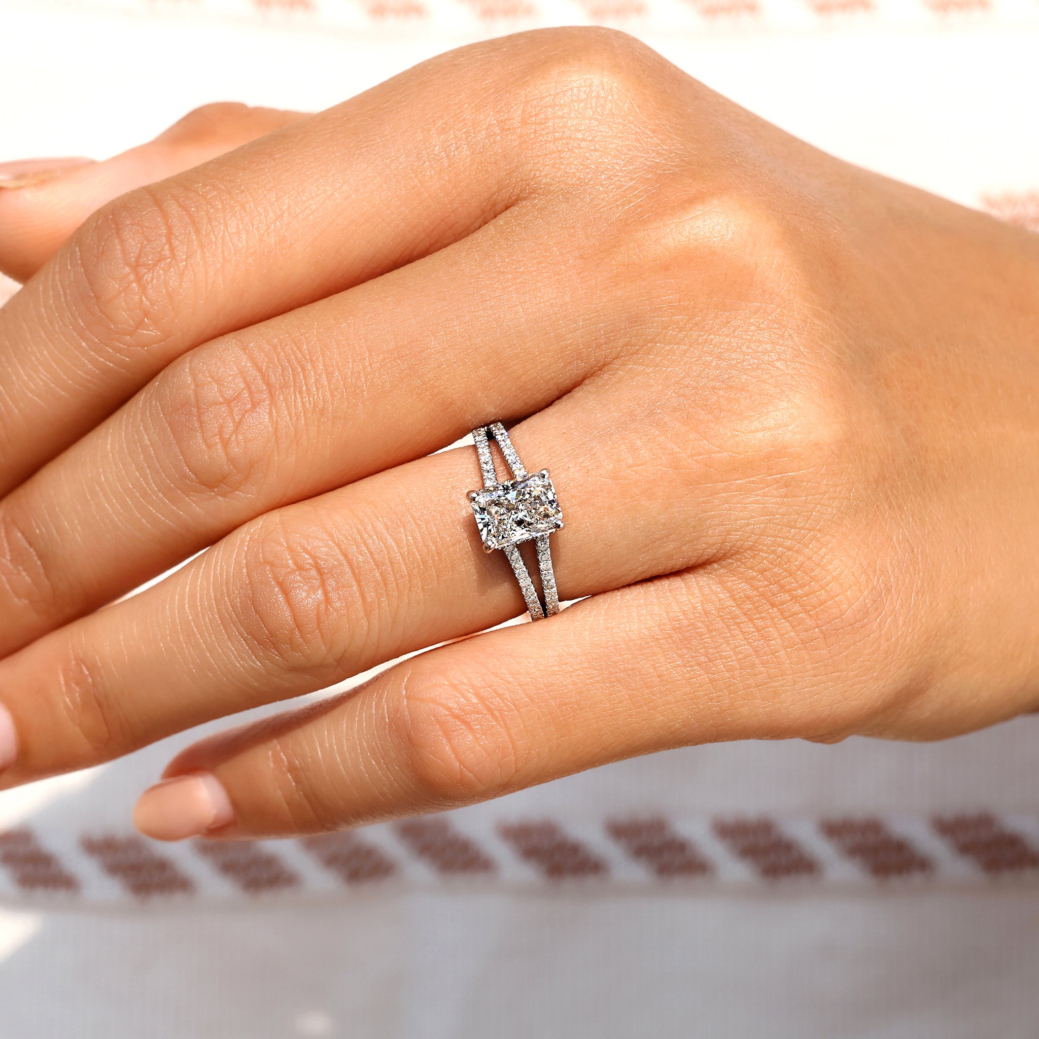 Four prong setting radiant cut diamond ring.
