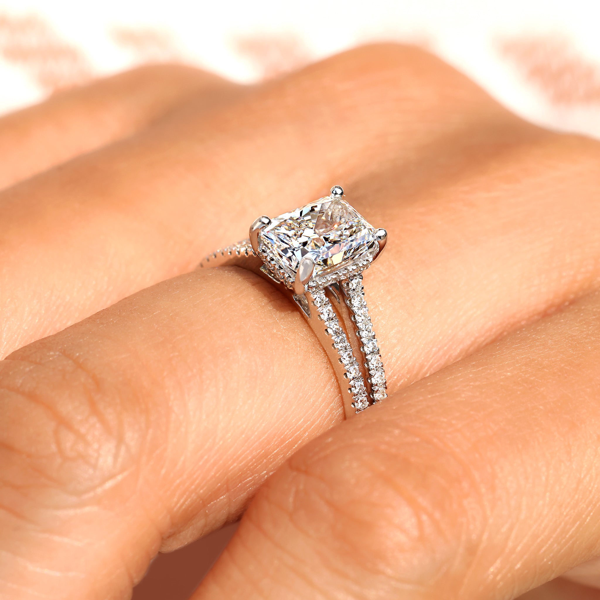 Hidden halo style radiant cut diamond ring.

