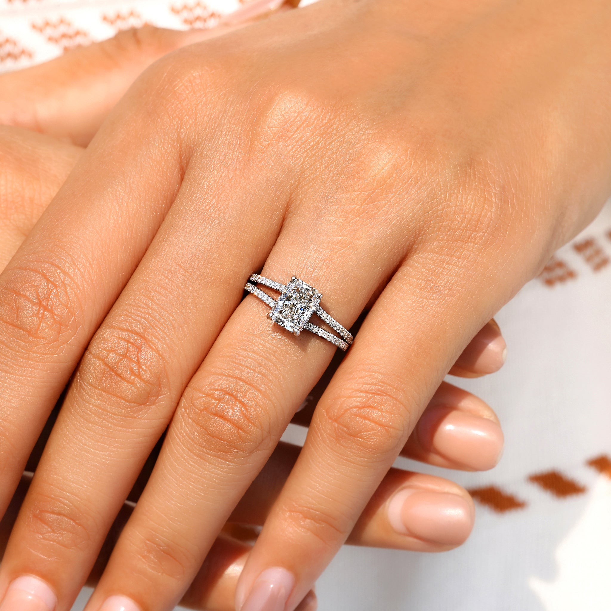 Split shank cathedral setting diamond ring.
