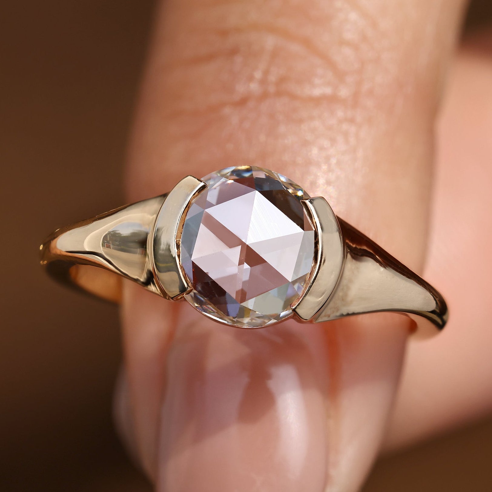 Solitaire diamond engagement ring with round rose cut diamond.
