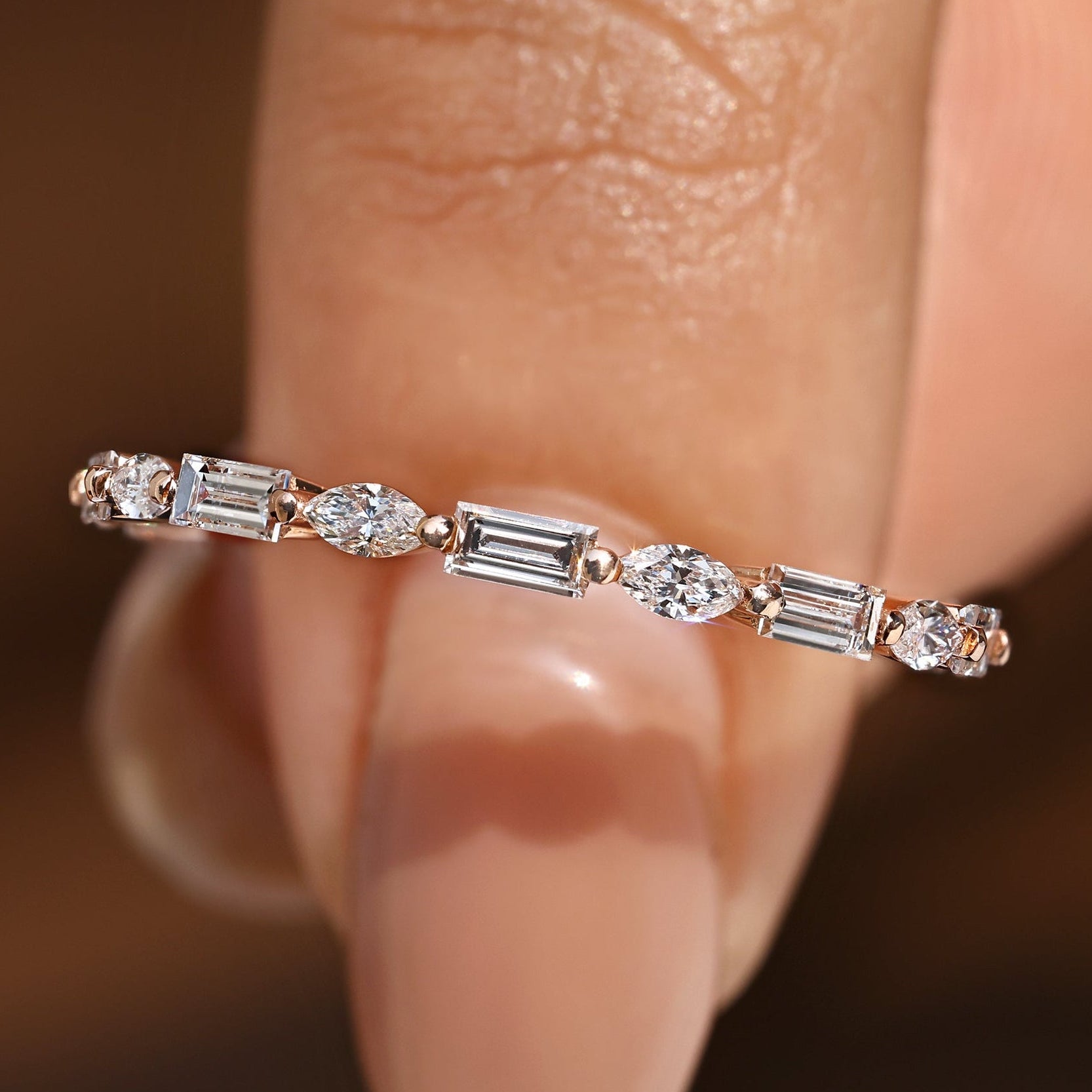 Diamond eternity band with marquise and baguette diamonds.
