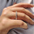 Yellow Gold Wedding Band featured on a soft fabric backdrop.
