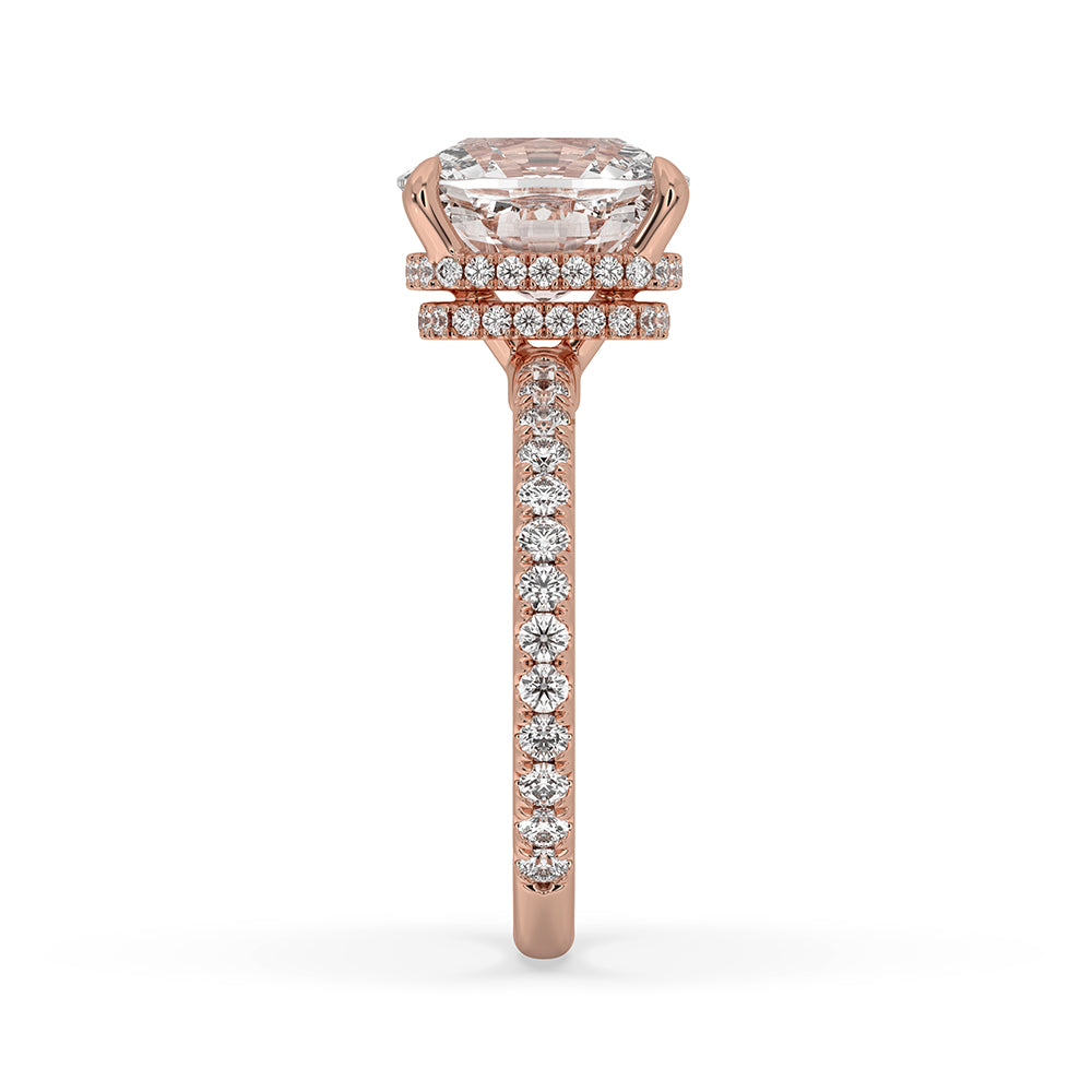 Carat Diamonds engagement ring with round cut diamond and pave accents.
