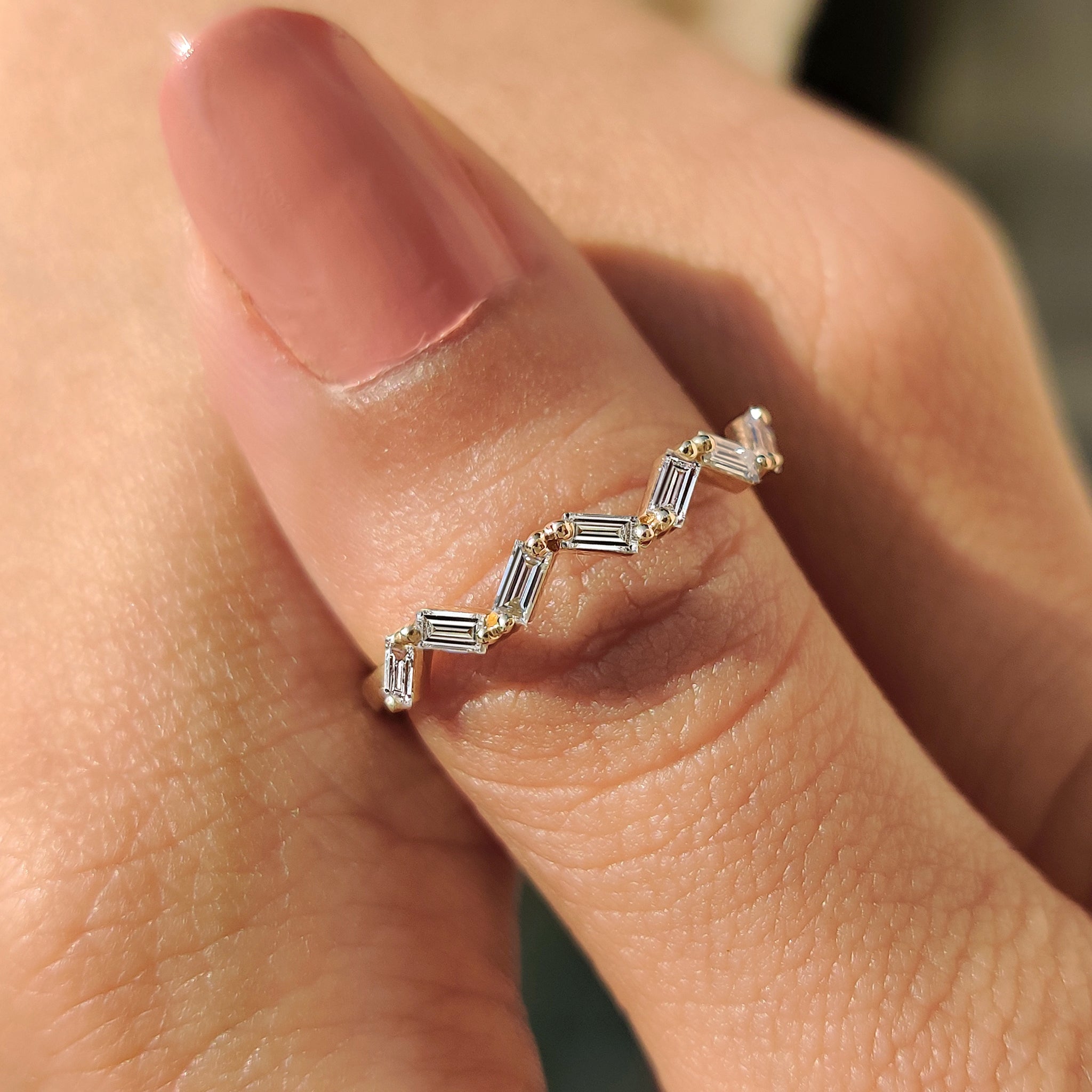 Carat Diamonds band featuring high-quality diamonds for a luxurious look.
