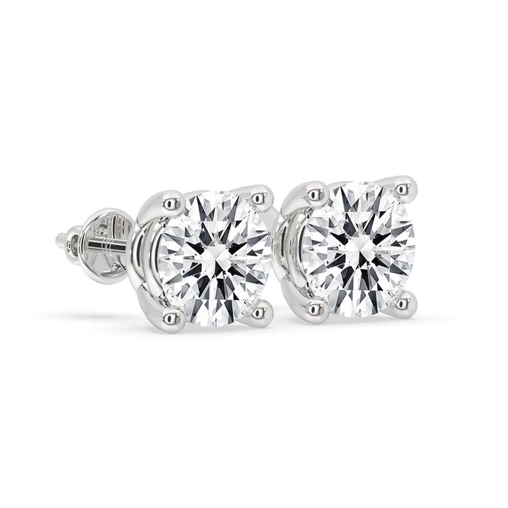 Pair of 1 ct diamond stud earrings in a classic four-prong setting, showcasing their brilliant sparkle and elegant design.