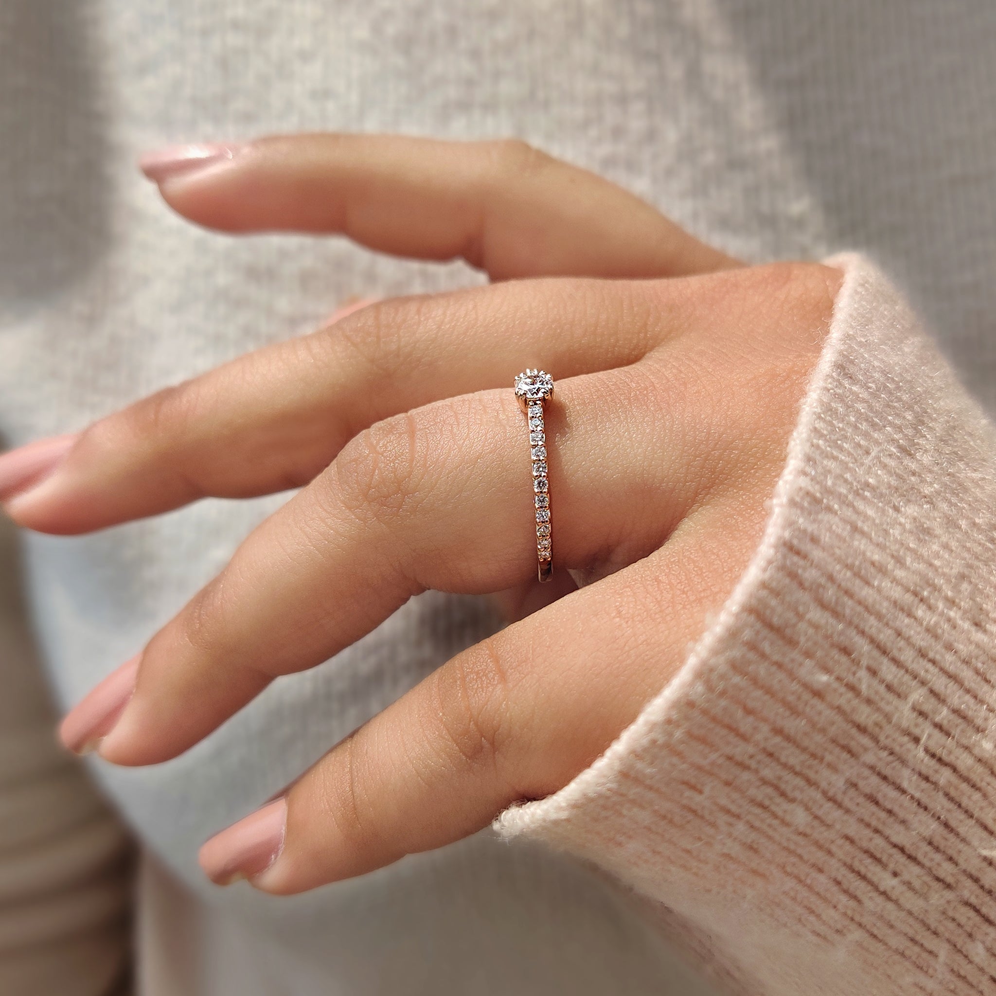 A rose gold diamond ring with shine
