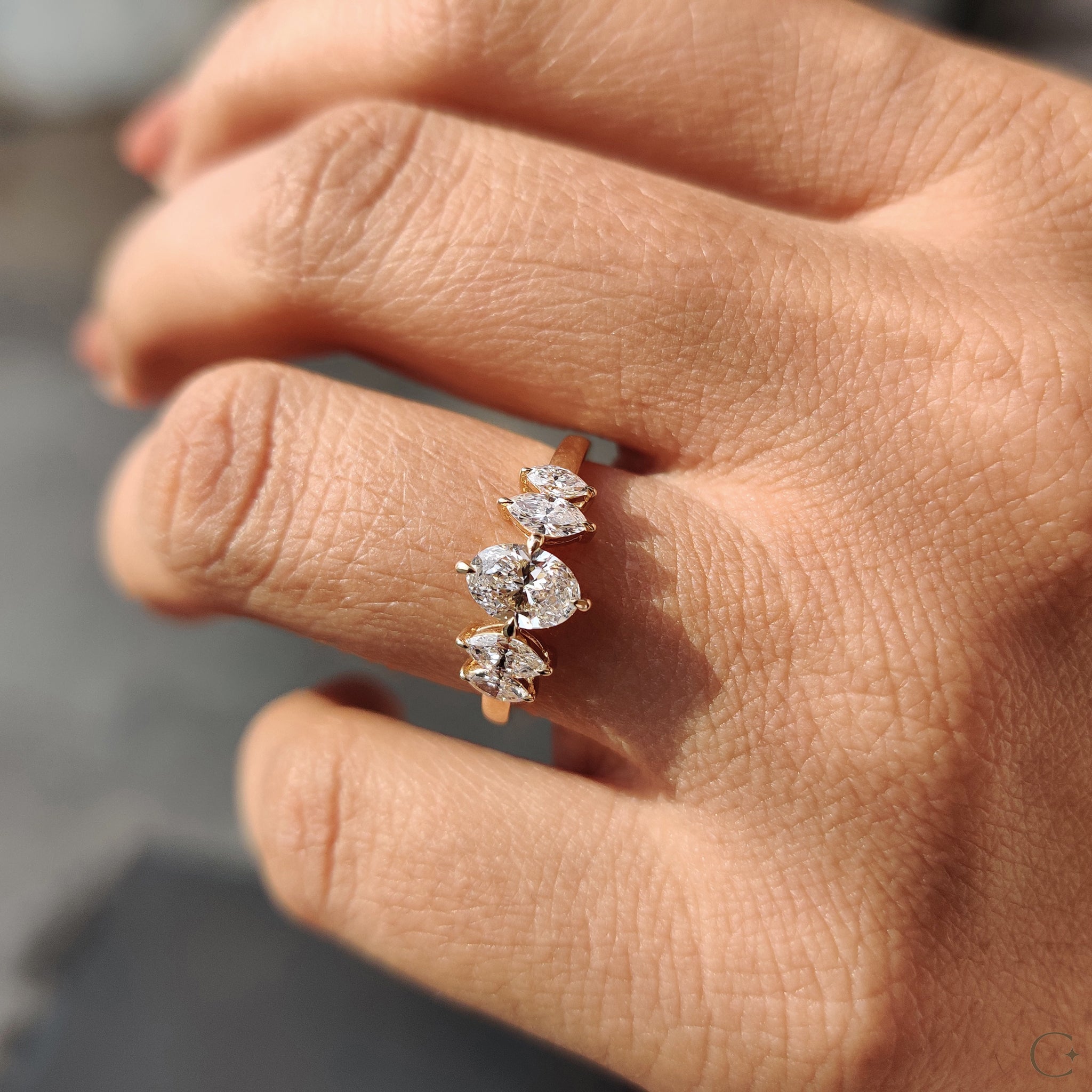 Diamond ring featuring a compass prong setting.
