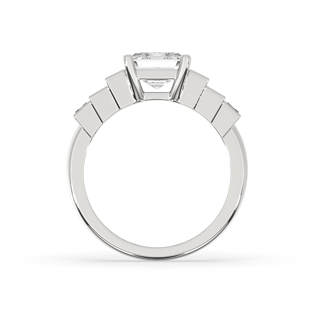 Prong setting ring with emerald and baguette cut diamonds.
