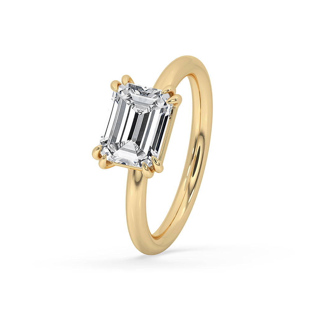 Double claw prong ring featuring a lab grown diamond in a handmade setting.
