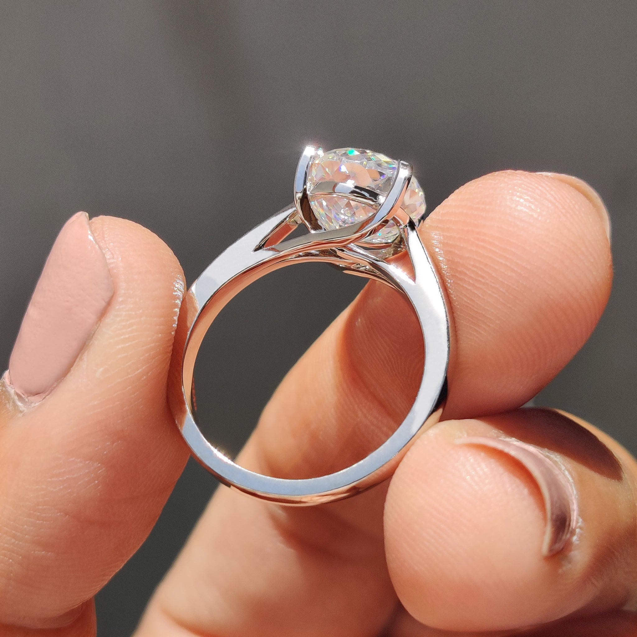 Moissanite engagement ring captures endless bright energy inside.