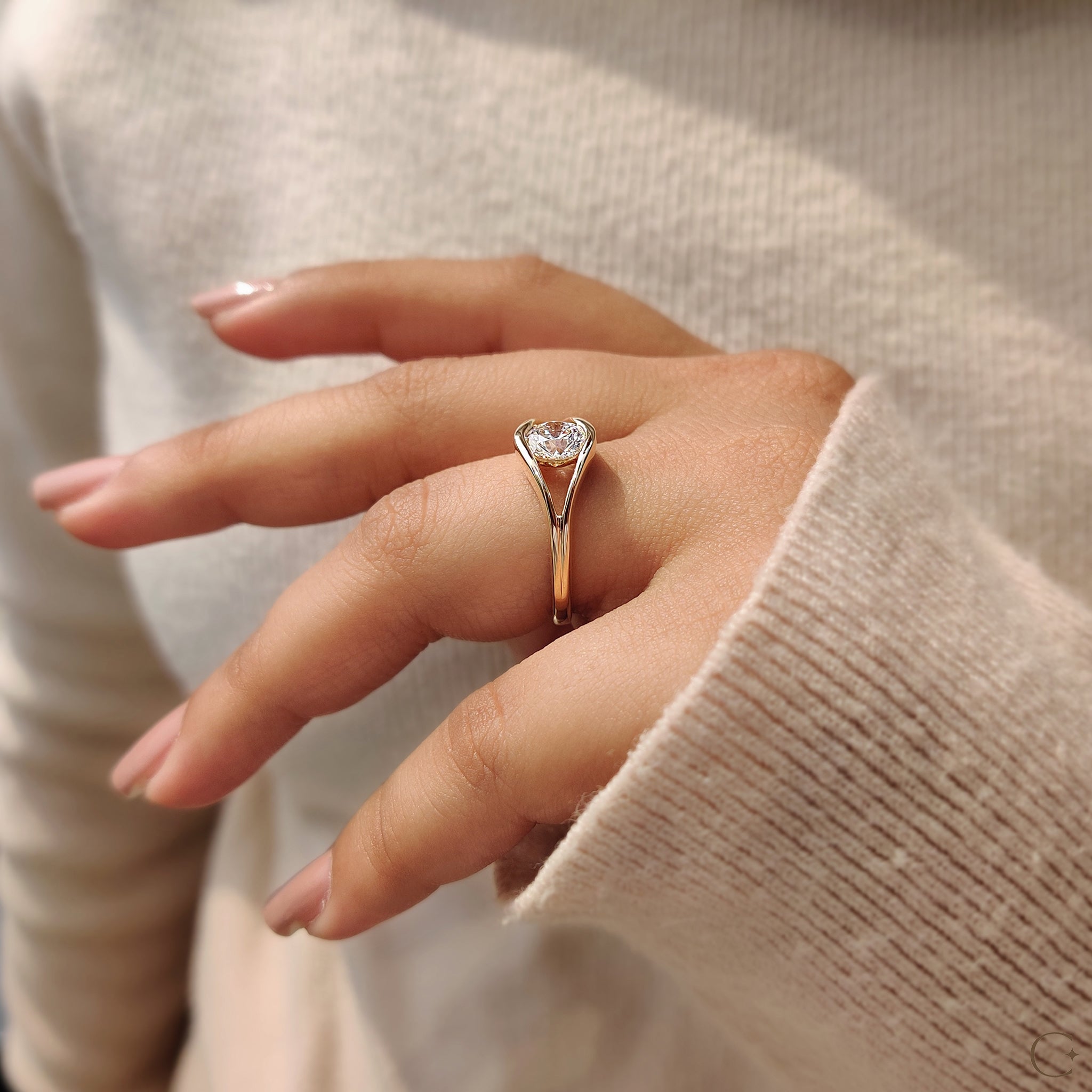 A split shank ring with a round diamond center
