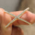 Gold criss cross ring featuring intersecting bands and modern design, perfect for stylish stacking.