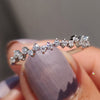 Prong set moissanite half eternity band
