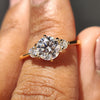 3 stone round engagement ring in yellow gold with a classic cathedral setting.
