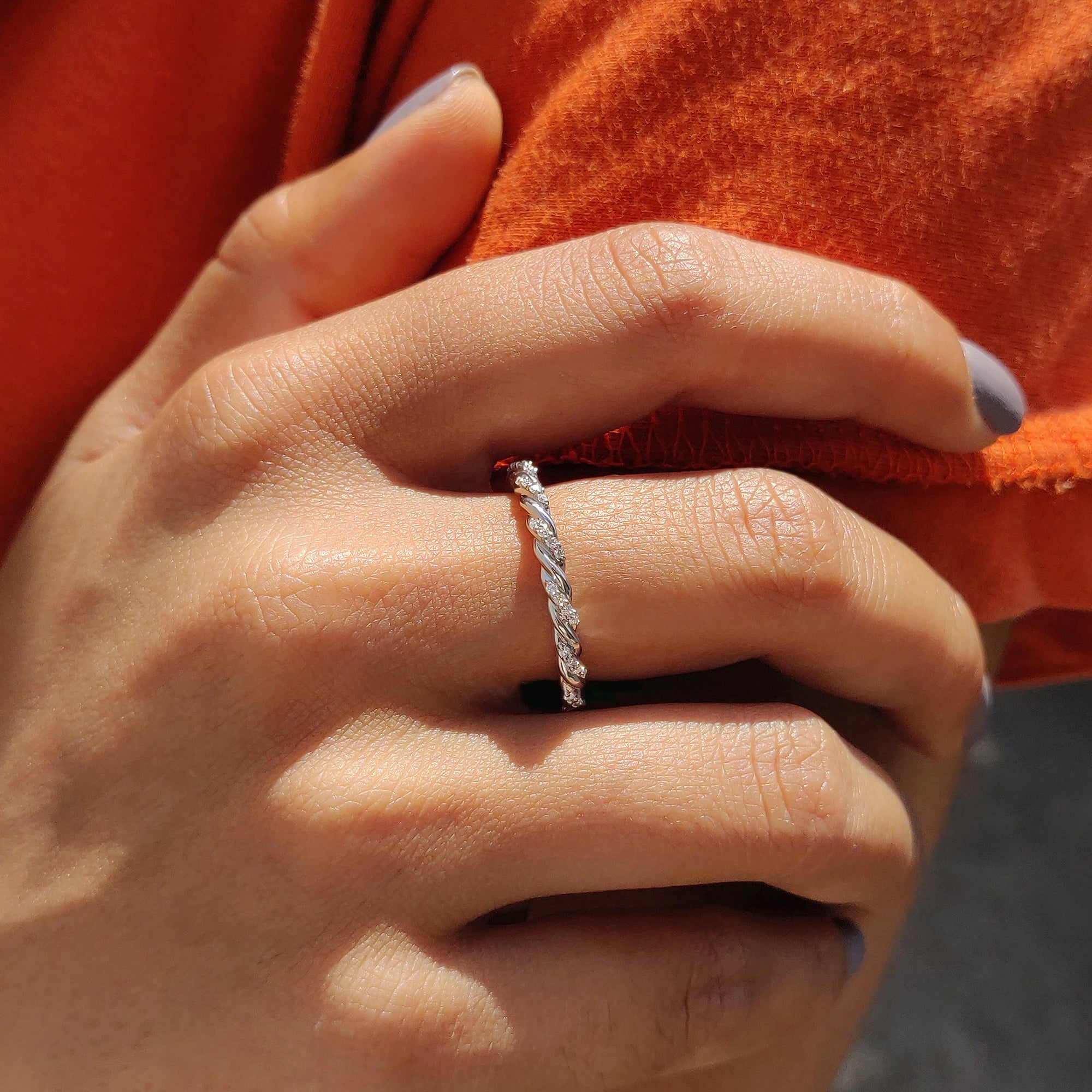 Round moissanite wedding band in white gold
