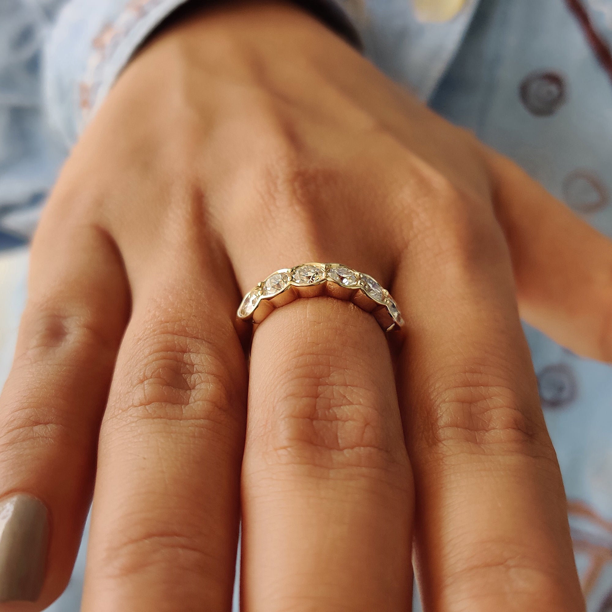 6 stone wedding band designed with moissanite and expert craftsmanship.
