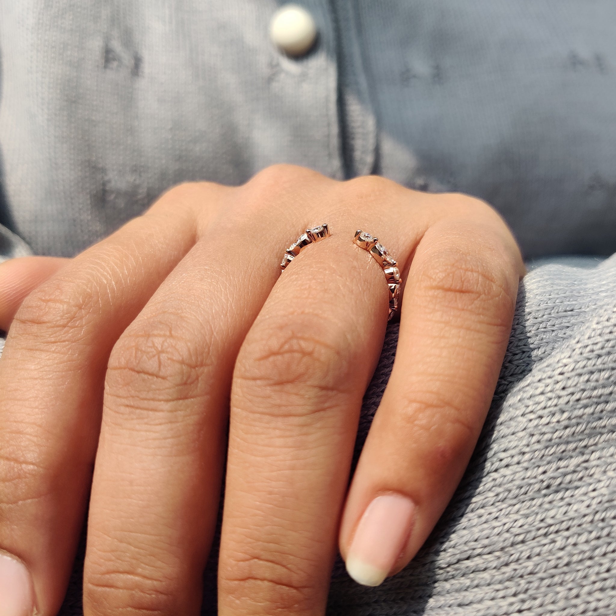 Round and marquise wedding band crafted with a gold proposal band style.